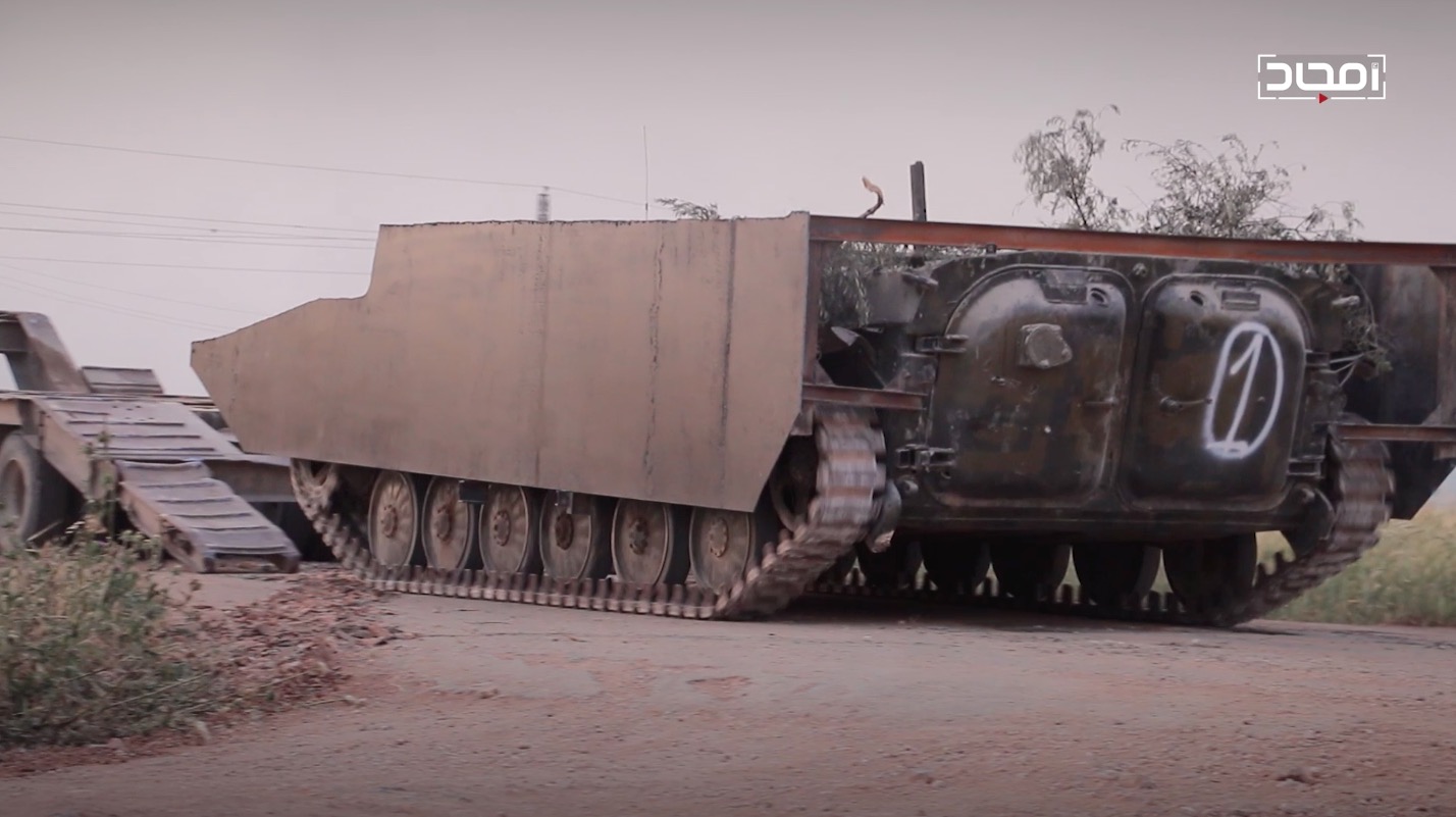 An HTS up-armored BMP-1 SVBIED that got stuck near Sakhr village southeast of Kafr Nabudah sometime between May 12 and 26, 2019, shown here in HTS media before it set off.