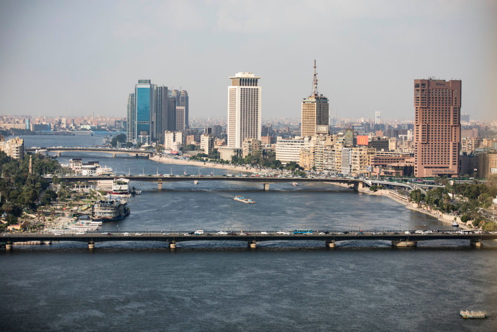 A complete overview of the Ramses Hilton Hotel (R), the Maspero Television Building (C) and the building of the Egyptian Ministry of Foreign Affairs with a view of the Qasr El Nil Bridge (front) on the banks of the Nile. 