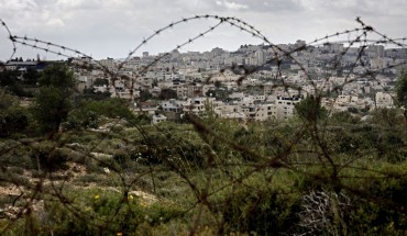 A picture taken from the Israeli settlement of Gilo in Jerusalem, shows the occupied West Bank city of Bethlehem behind barbed wire, on April 17, 2019..