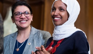 Reps. Ilhan Omar, D-Minn., right, and Rashida Tlaib, D-Mich., attend a rally with Democrats in the Capitol to introduce the "Equality Act," which will amend existing civil rights legislation to bar discrimination based on gender identification and sexual orientation on Wednesday, March 13, 2019. 