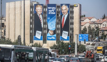 A general view of an election campaign banner depicting Israeli Prime Minister Benjamin Netanyahu (R), head of the Likud Party, shaking hands with US President Donald Trump, ahead of the snap Israeli legislative election, scheduled to take place on 17 September 2019