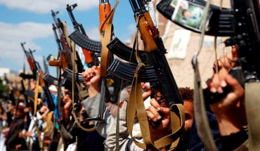 Houthi followers hold their guns during a tribal gathering against the continued war and blockade on October 03, 2019 in Sana'a, Yemen
