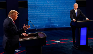 President Donald Trump answers a question as Democratic presidential candidate former Vice President Joe Biden listens during the second and final presidential debate at Belmont University on October 22, 2020 in Nashville, Tennessee. This is the last debate between the two candidates before the election on November 3.