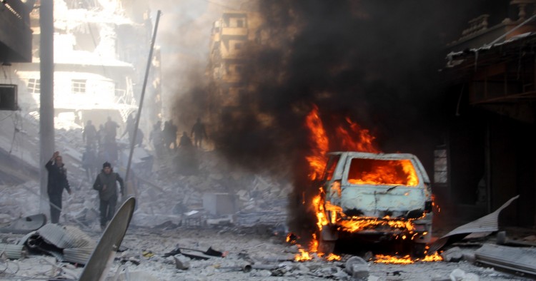 Firefighters extinguish a fire after ISIS terrorists’ car-bomb attack against Ahrar ash-Sham Headquarters in Aleppo, Syria on January 25, 2016. 
