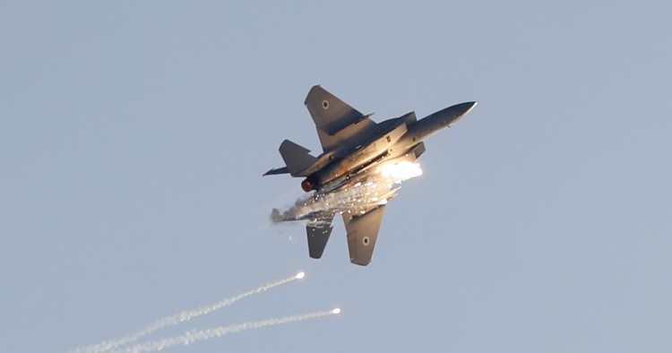 An Israeli F-15 I fighter jet launches anti-missile flares at it performs during a graduation ceremony of Israeli air force pilots at the Hatzerim Air Force base in Israel's Negev desert on December 26, 2018. (Photo by JACK GUEZ / AFP) (Photo credit should read JACK GUEZ/AFP/Getty Images)