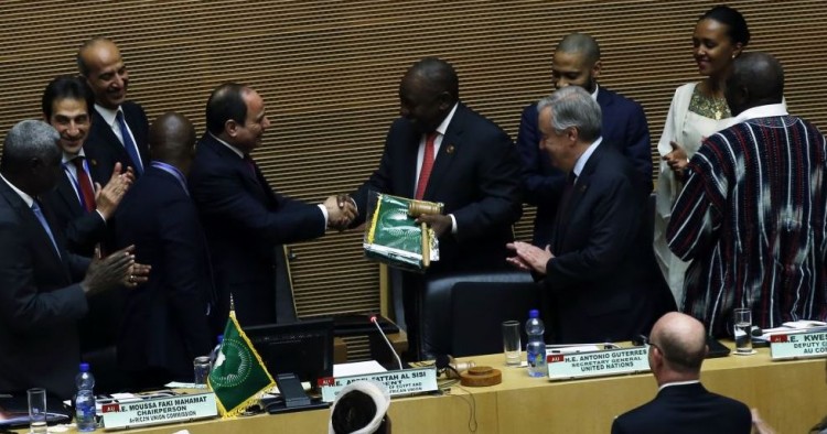 South African President Cyril Ramaphosa (5th R) assumes gavel for a year-long African Union (AU) presidency from the outgoing Abdel-Fattah El-Sisi (5th L), the Egyptian president, during the 33rd African Union Heads of State Summit in Addis Ababa, Ethiopia on February 09, 2020. 