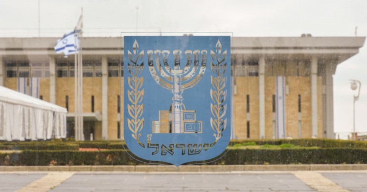 An emblem of Israel with the Knesset in the background, seen on the day of Israeli Legislative Elections 2020, in Central Jerusalem.