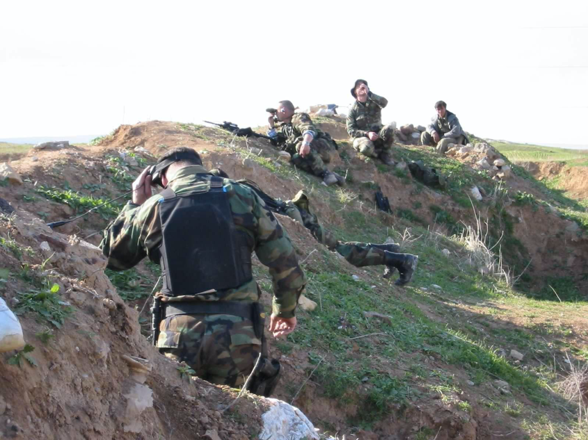 Photo right: NILE team and 10th Special Forces with Peshmerga along the Green Line, April 2003.