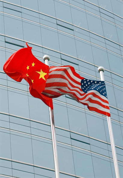 Chinese and US flags. Source: Teh Eng Koon/AFP via Getty Images