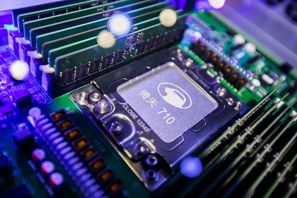 Server chip Yitian 710 developed by Alibaba’s in-house semiconductor unit on display during Aspara Conference 2021. Photo by Xu Kangping/VCG via Getty Images