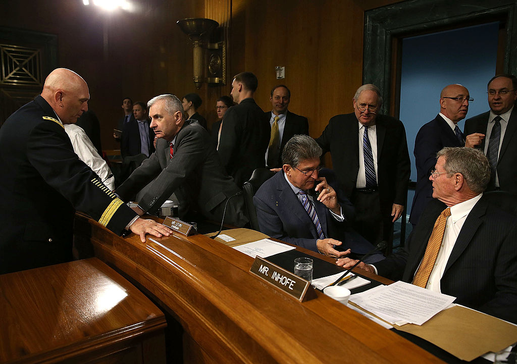 Chief of Staff of the U.S. Army Gen. Raymond Odierno (L), talks with Sen. Jack Reed (D-RI) (2nd-L) while Senators Joe Manchin (D-WV)(C), Chairman Carl Levin (D-MI) and James Inhofe (R-OK) (R) converse, before the start of a Senate Armed Services Committee hearing, on April 23, 2013 in Washington, DC. The committee is hearing testimony on the Department of the Army budget request for FY2014. (Photo by Mark Wilson/Getty Images)