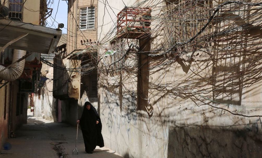 A random web of elctric wires dangle on the walls of a narrow alley in the Iraqi capital Baghdad's Bab Al-Seef neighbourhood on June 11, 2019. (Photo by SABAH ARAR / AFP) (Photo credit should read SABAH ARAR/AFP via Getty Images)
