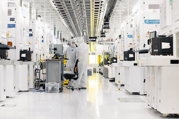 Technicians in a clean room at a semiconductor fabrication plant in Dresden, Germany, Nov. 30, 2022. Photo by Liesa Johannssen/Bloomberg via Getty Images.