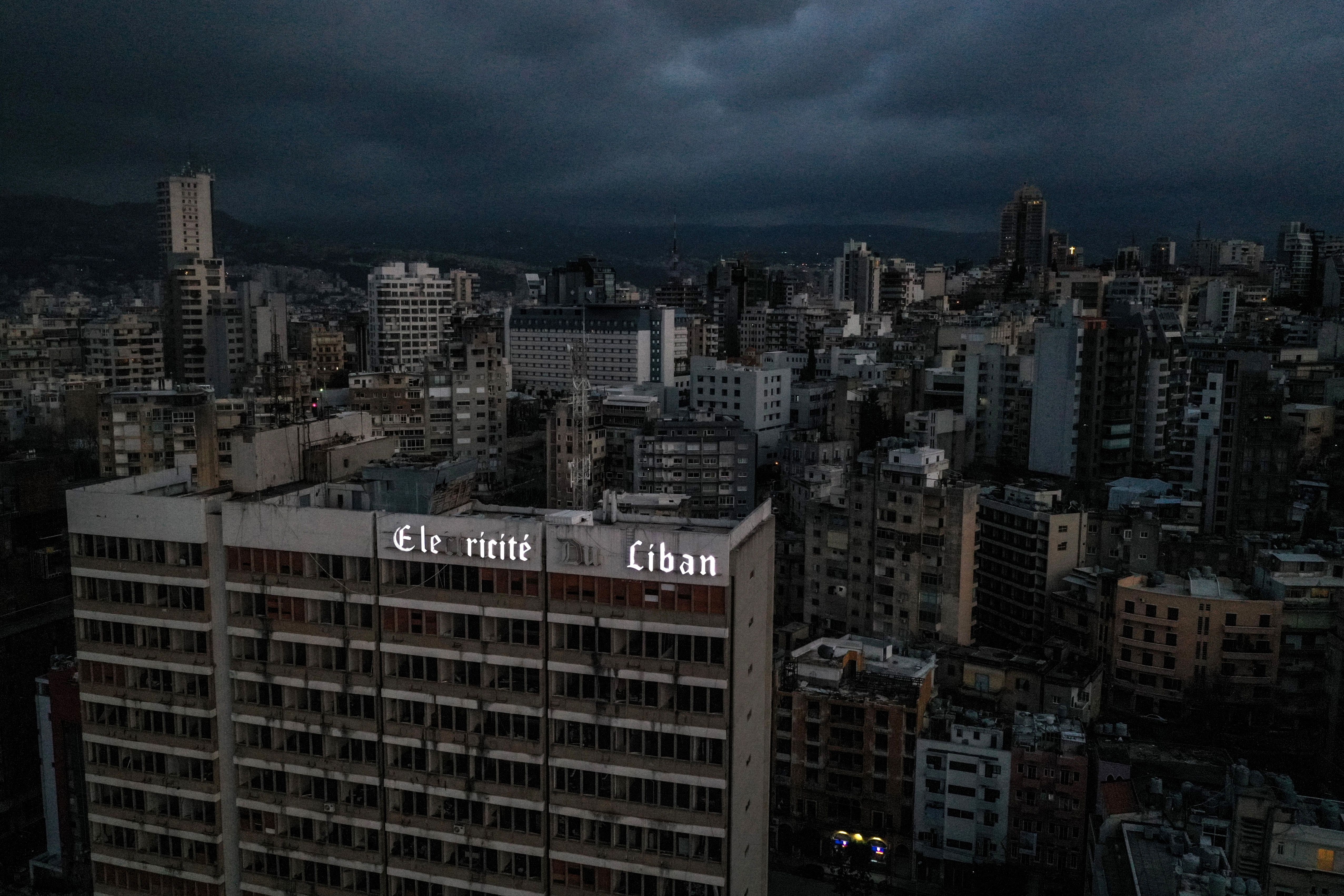 An aerial view shows Lebanon's capital Beirut in darkness during power outage on April 3, 2021. - As Lebanon battles its worst financial crisis in decades, the local currency has lost more than 85 percent of its value on the black market. Even the country's once richest city council says it is struggling to maintain its streets, as the economic squeeze puts pressure on already rundown infrastructure. (Photo by Dylan COLLINS / AFP) (Photo by DYLAN COLLINS/AFP via Getty Images)