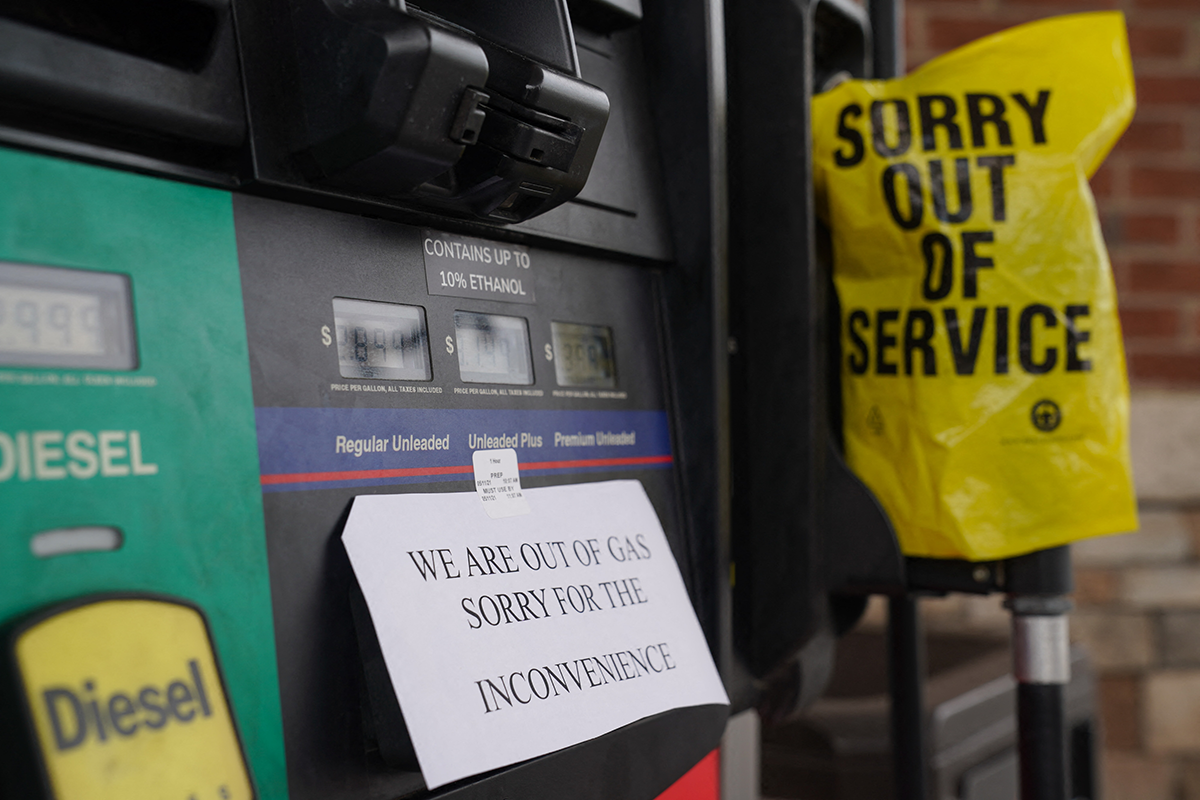A sign warns consumers about gasoline shortages at a RaceTrac gas station in Smyrna, Georgia, on May 11, 2021, following a ransomware attack on Colonial Pipeline. Photo by ELIJAH NOUVELAGE/AFP via Getty Images.