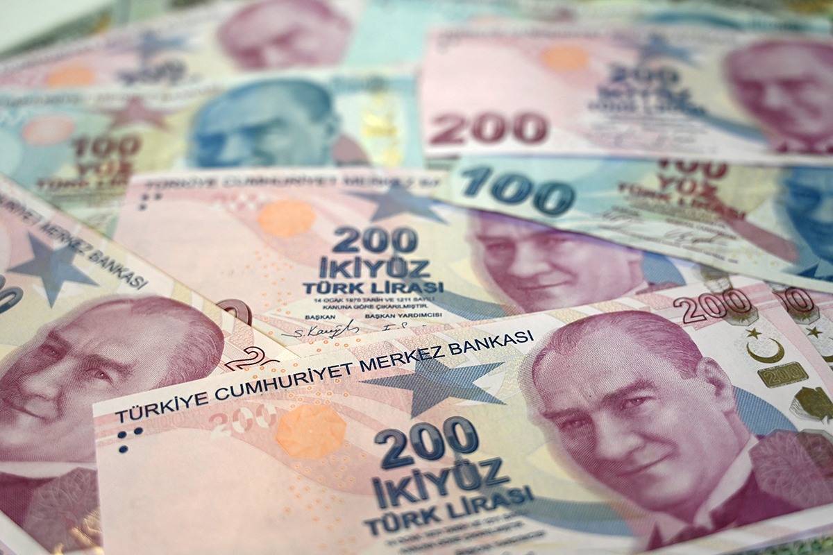 Turkish lira banknotes on display on December 3, 2021, after a currency crisis the previous month caused the Turkish lira to hit then record lows against the dollar. Photo by OZAN KOSE/AFP via Getty Images.