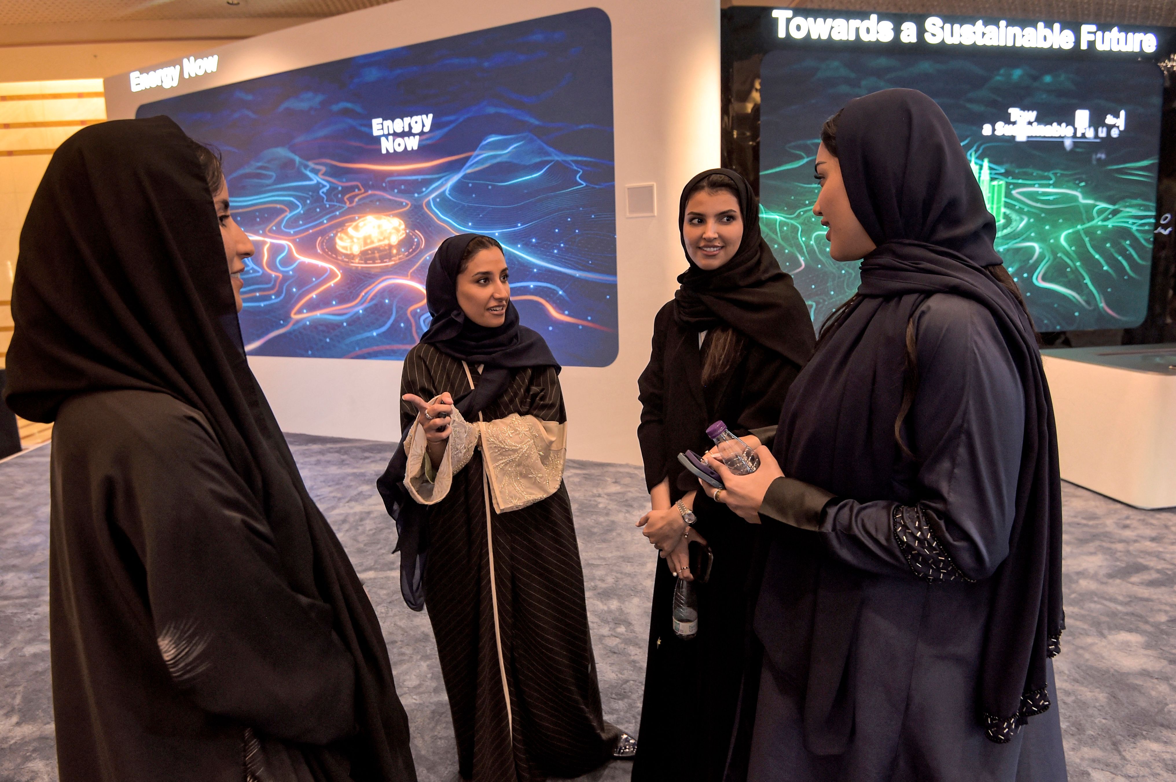 Local hosts during a presentation on the Saudi Green Initiative in the Red Sea coastal city of Jeddah on July 14, 2022, ahead of a visit by the US president. Photo by AMER HILABI/AFP via Getty Images.