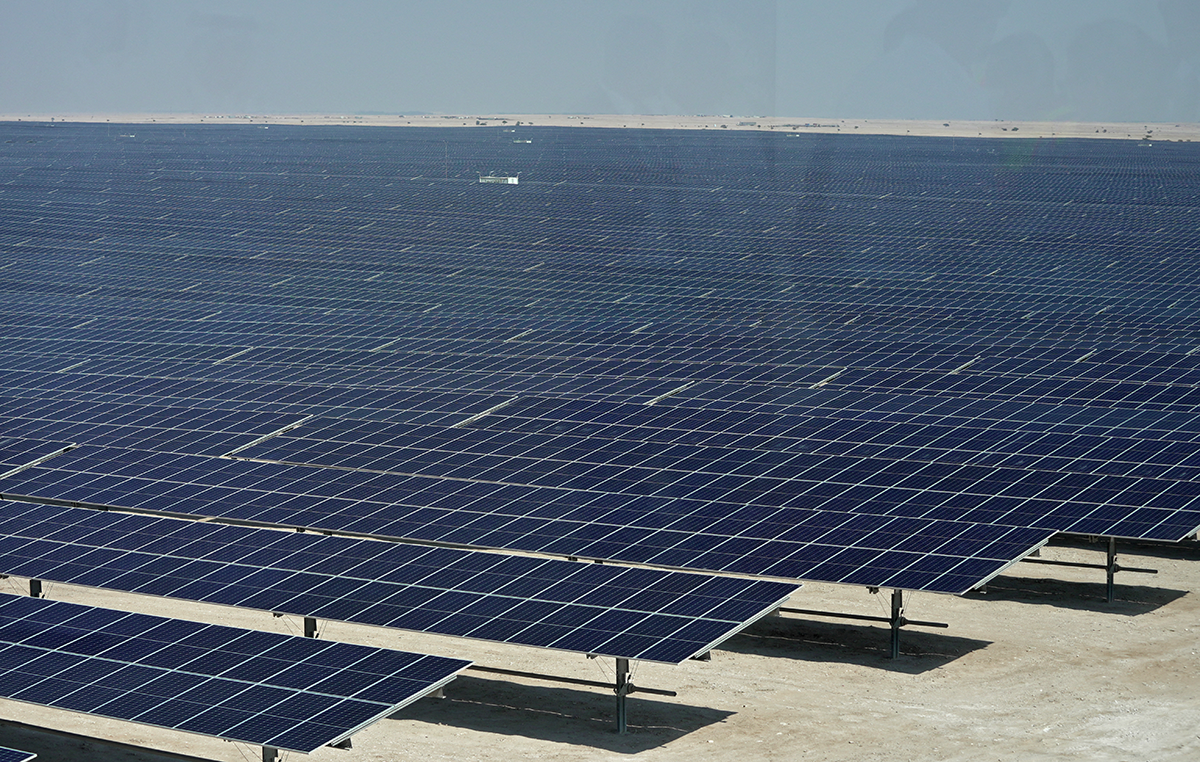 Solar panels at the newly inaugurated al-Kharsaah solar power plant in Qatar. Photo by IVAN PISARENKO/AFP via Getty Images.