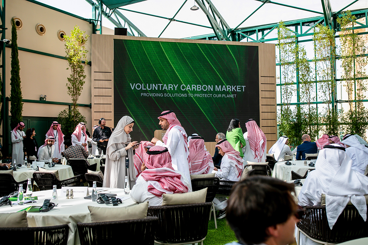 Attendees gather ahead of a voluntary carbon market auction at the Future Investment Initiative (FII) conference in Riyadh, Saudi Arabia, on Oct. 25, 2022. Photo by Tasneem Alsultan/Bloomberg via Getty Images.