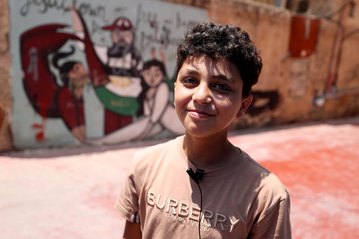 11-year-old Palestinian boy Adam Moustafa who takes music classes at Freedom Theatre poses duringa in Jenin, West Bank on June 19, 2023. The Freedom Theatre has become a cultural resistance for Palestinian youth as they find opportunity to participate in acting, musing and dancing classes since 2006 when it was founded. (Photo by Issam Rimawi/Anadolu Agency via Getty Images)