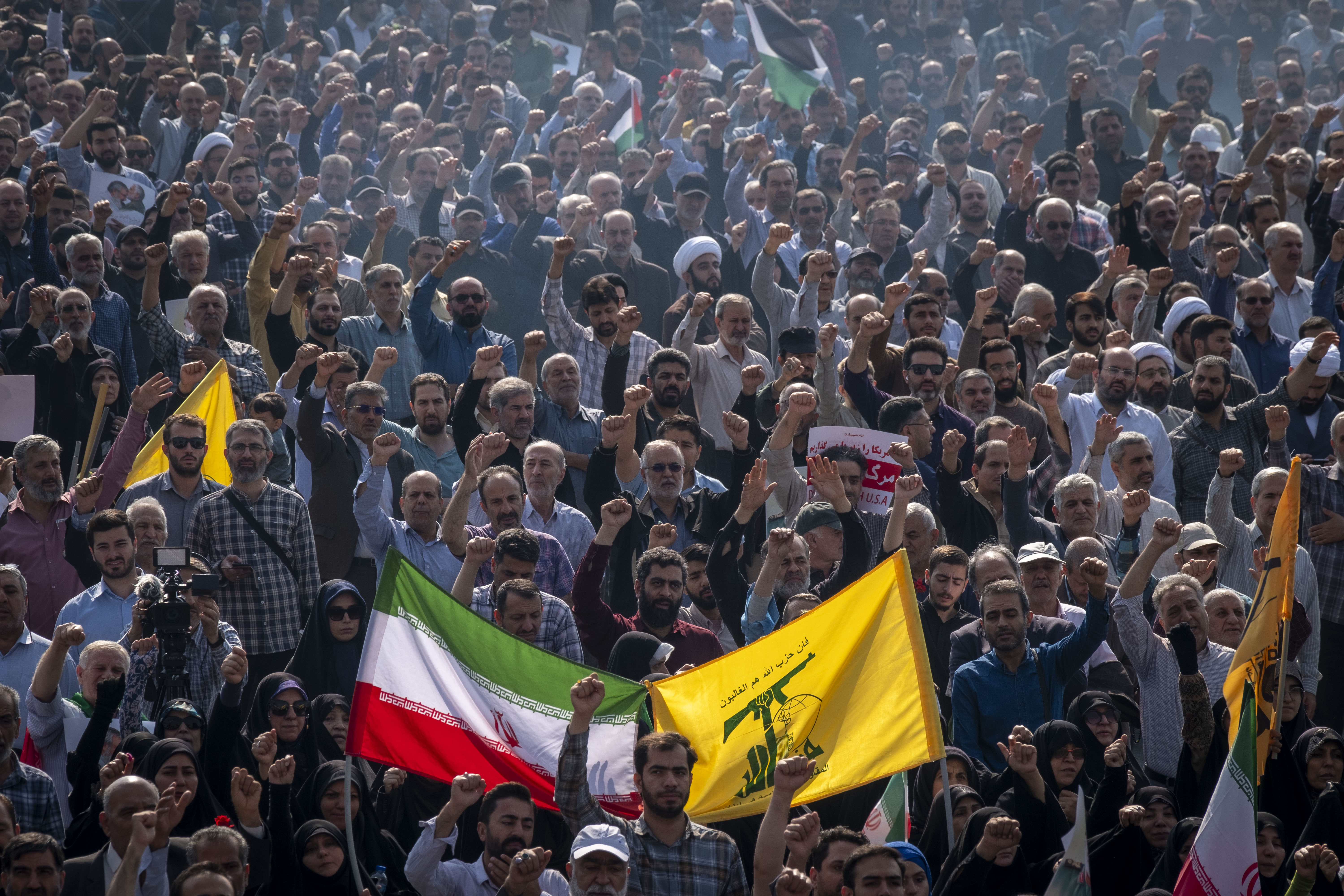 Iranians shout anti-Israel and anti-US slogans during a funeral for Abbas Nilforoushan, an Islamic Revolutionary Guard Corps commander who was killed in an Israeli airstrike on Oct. 15, 2024. Photo by Morteza Nikoubazi/NurPhoto via Getty Images.