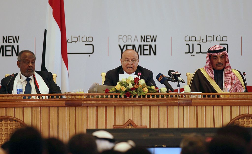 Yemen's President Abed Rabbo Mansour Hadi (C) speaks during the closing ceremony of a National Dialogue Conference aimed at drafting a new constitution and establishing a federal state on January 25, 2014 in Sanaa. (Photo by MOHAMMED HUWAIS/AFP/Getty Images)