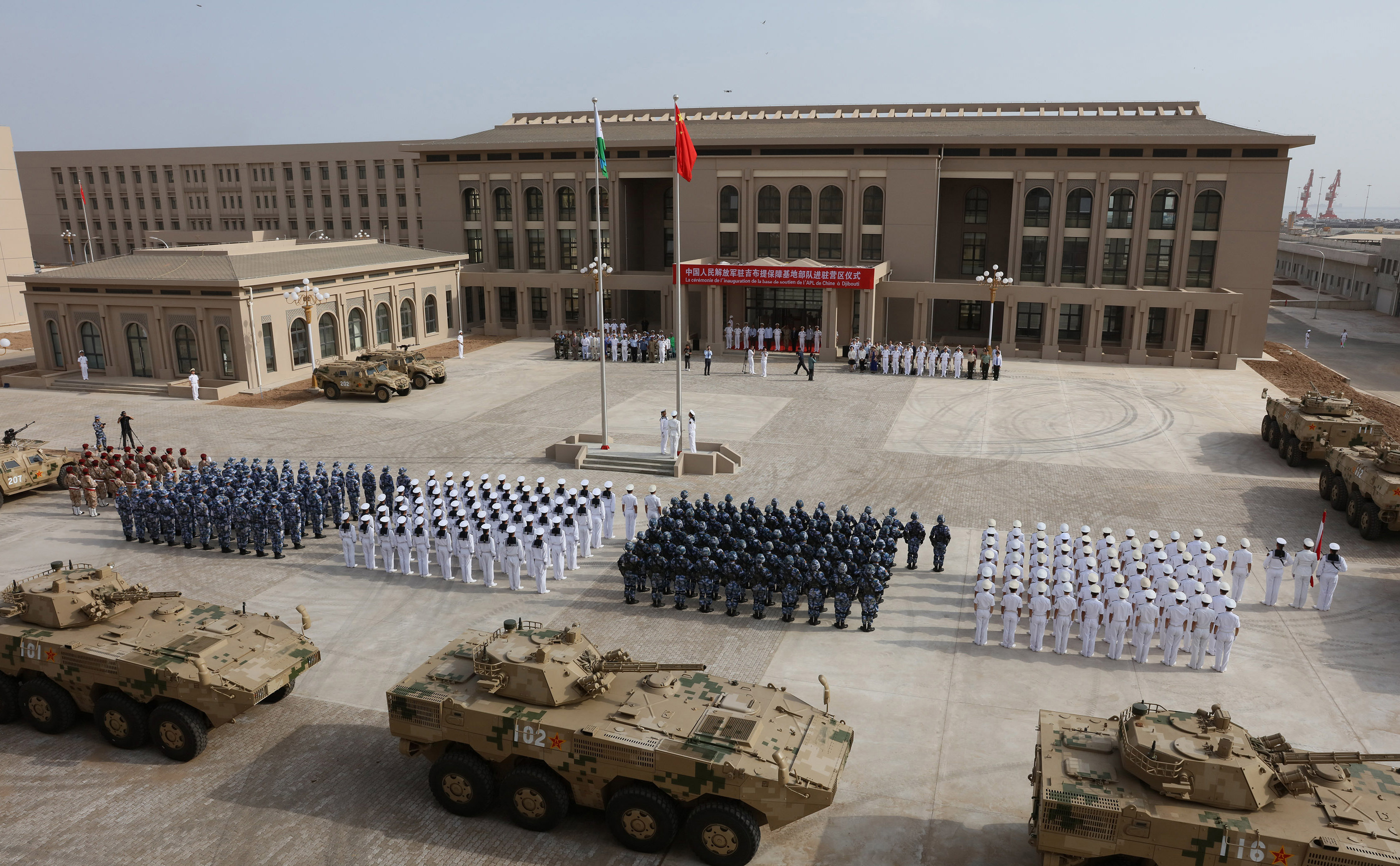 This photo taken on August 1, 2017 shows Chinese People's Liberation Army personnel attending the opening ceremony of China's new military base in Djibouti. China has deployed troops to its first overseas naval base in Djibouti, a major step forward for the country's expansion of its military presence abroad. / AFP PHOTO / STR / China OUT (Photo credit should read STR/AFP via Getty Images)