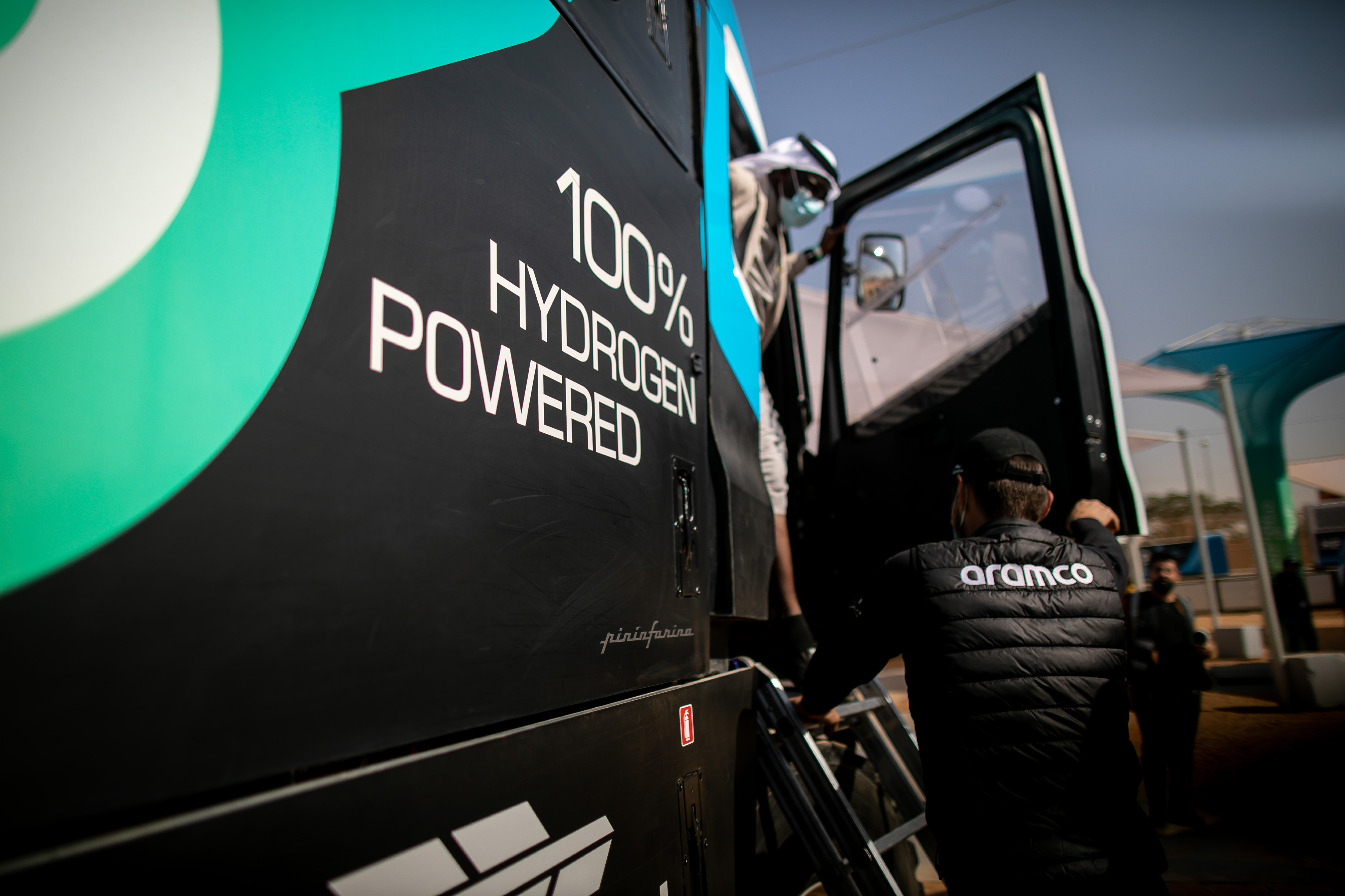 Visitors inspect Saudi Aramco’s H2 hydrogen-powered racing truck, developed by Gaussin, during the Dakar Rally in Riyadh, on January 8, 2022. Photo by Tasneem Alsultan/Bloomberg via Getty Images.