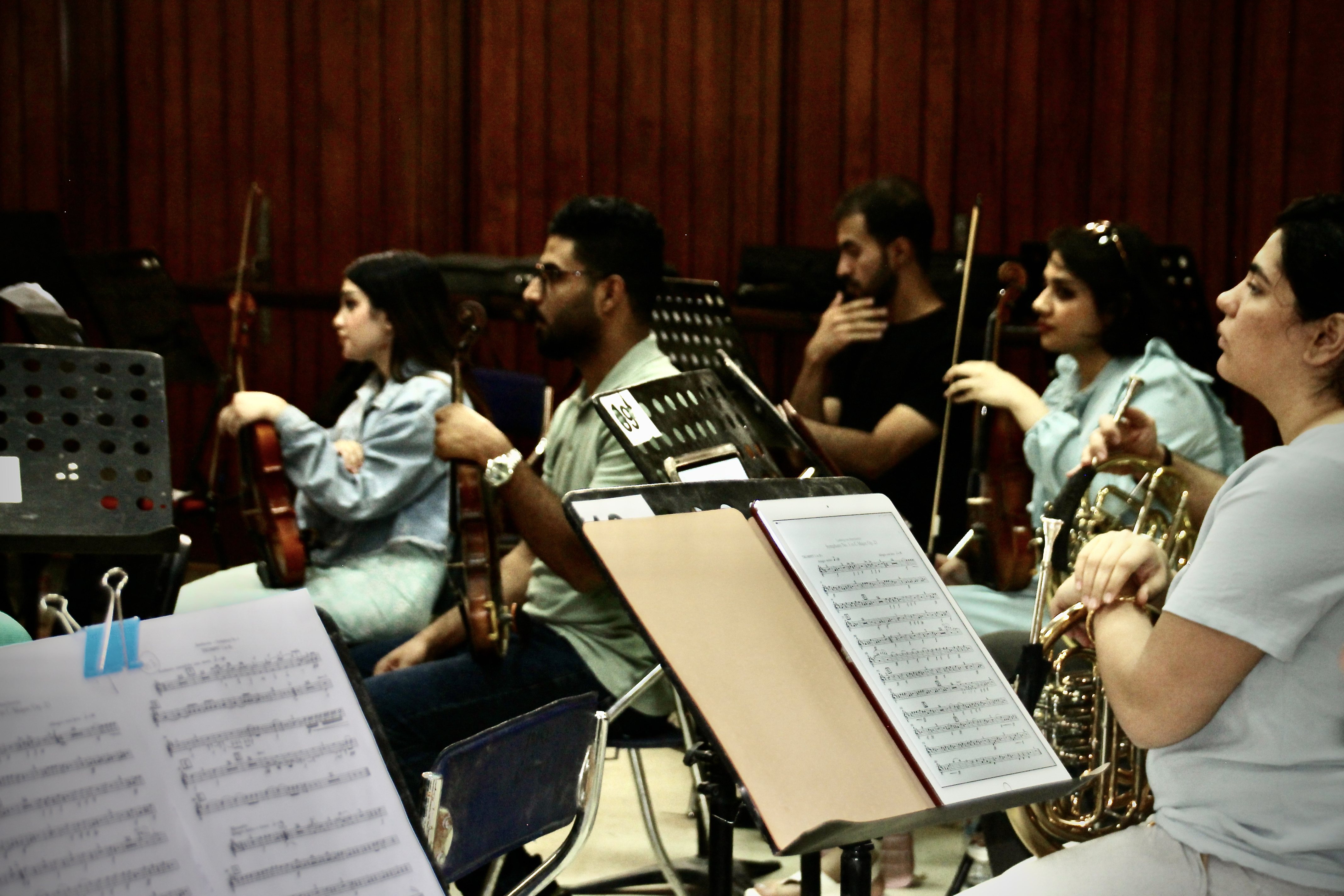 Men and women gathered to play in a collective orchestra. Photo courtesy of the author.