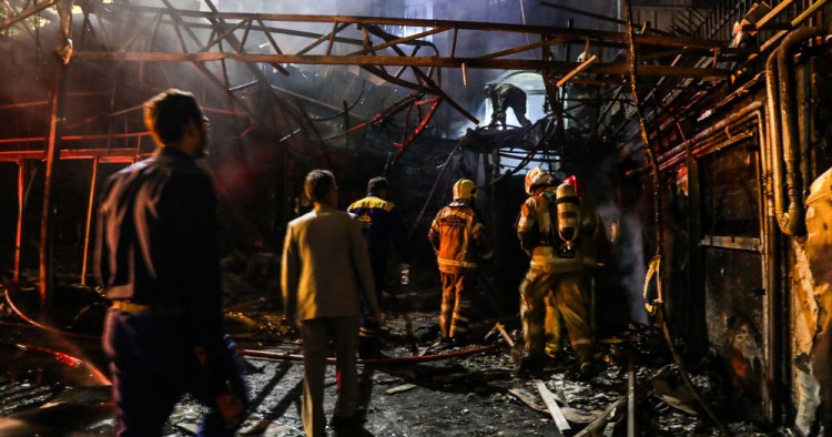 First responders gather at the scene of an explosion at the Sina At'har health centre in the north of Iran's capital Tehran northern Tehran on June 30, 2020.