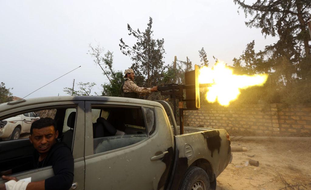 Fighters loyal to the Libyan internationally-recognised Government of National Accord (GNA) fire a heavy machine gun during clashes against forces loyal to strongman Khalifa Haftar, on May 21, 2019 in the Salah al-Din area south of the Libyan capital Tripoli. 