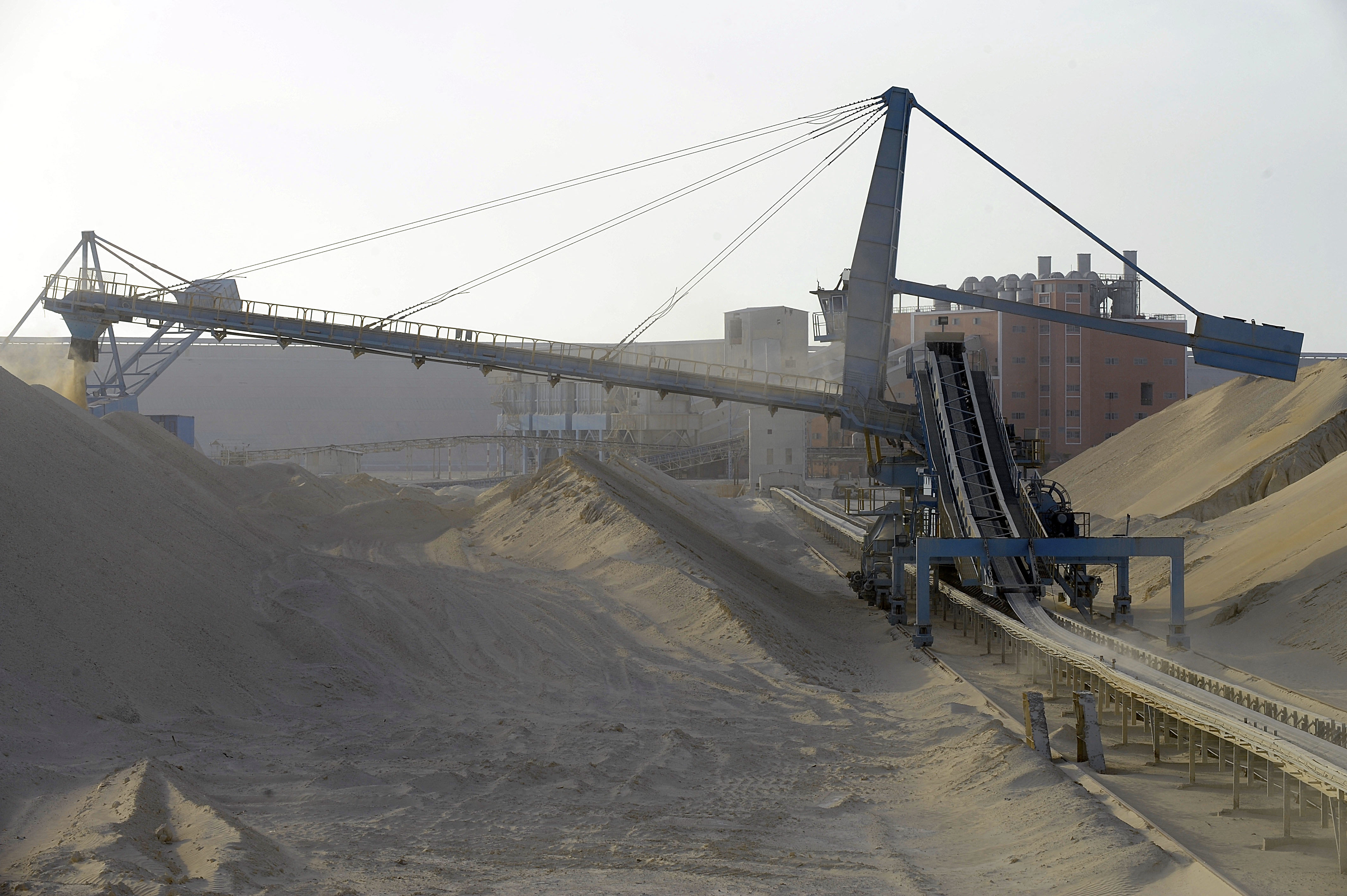 Untreated phosphate being dropped off at the end of a conveyor belt at the OCP’s Marca factory, near Laayoune, Western Sahara, on May 13, 2013. Photo by FADEL SENNA/AFP via Getty Images.