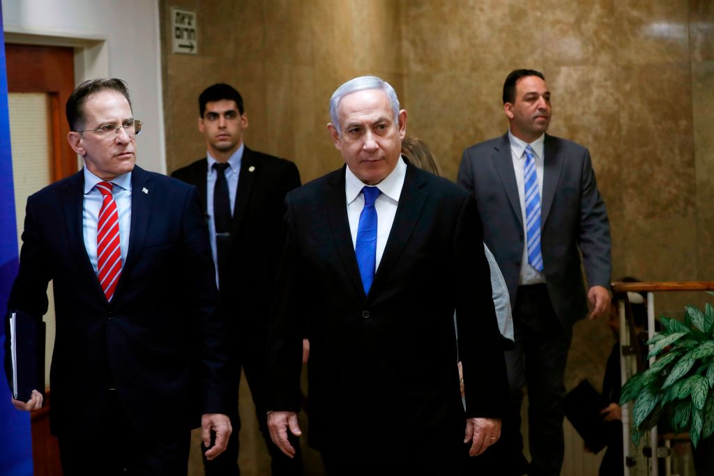 Israeli Prime Minister Benjamin Netanyahu (C) arrives at the weekly cabinet meeting in Jerusalem December 8, 2019. 
