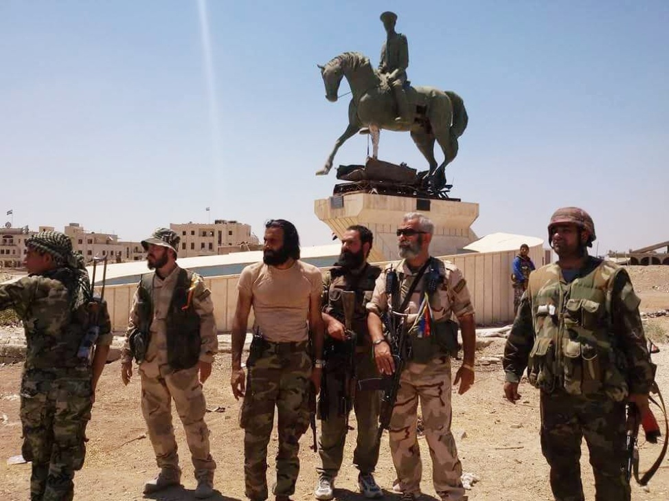 A 2015 picture of Abdel Basset (third from left) with 104th Brigade commander Issam Zahredinne (second from right) in Deir ez-Zor in 2015.