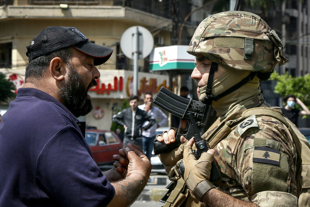 Photo above: An anti-government demonstrator argues with a Lebanese army officer during riots in the northern Lebanese port city of Tripoli on April, 20, 2020. Photo by Marwan Naamani/picture alliance via Getty Images.