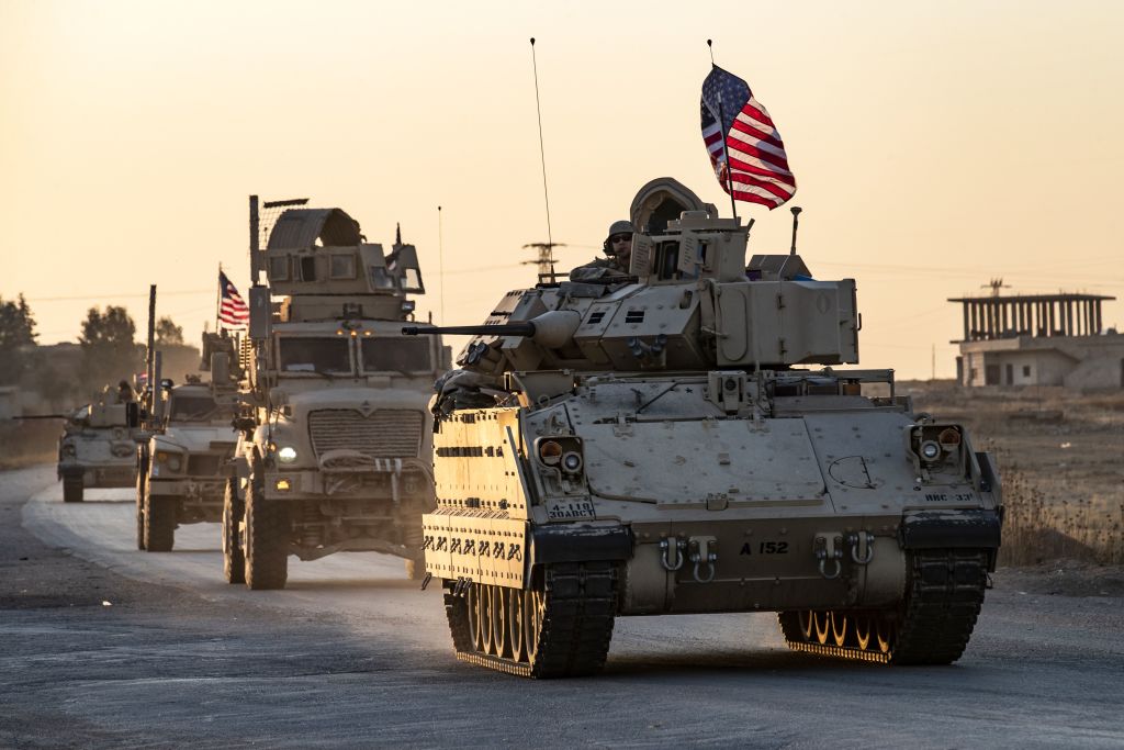 A convoy of US military vehicles drives near the town of Tal Tamr in the northeastern Syrian Hasakeh province on the border with Turkey, on November 10, 2019.