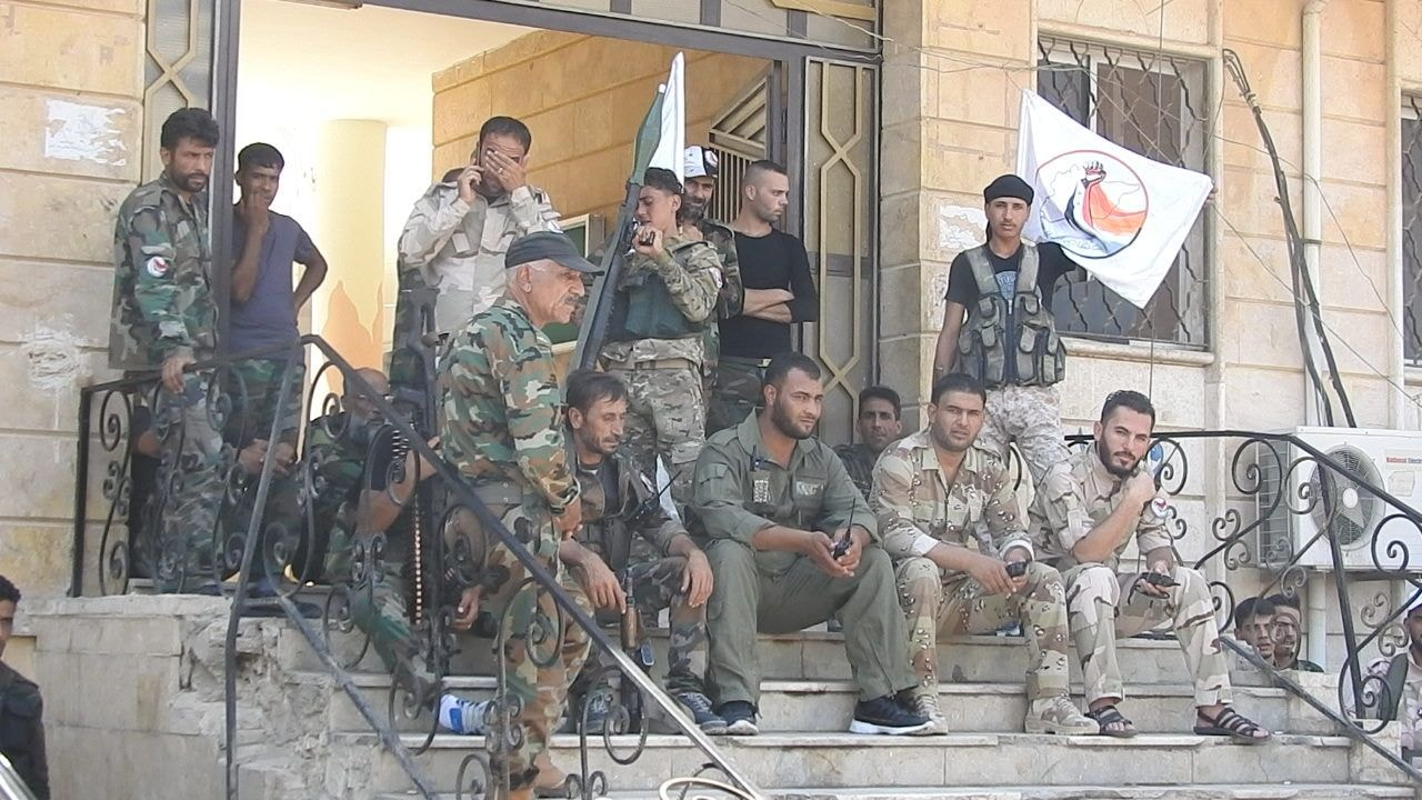 Deir ez-Zor National Defense Forces (NDF) fighters gather before a morning patrol, fall 2020.