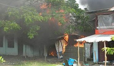 Rohinga village burning as they flee