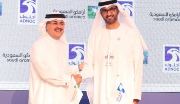 Sultan Ahmed al-Jaber(R), the director general and CEO of ADNOC, shakes hands with Saudi Aramco CEO Amin Nasser after signing a cooperation deal in Abu Dhabi on November 12, 2018.