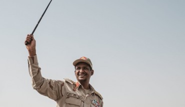 Mohamed Hamdan Dagalo, known as Himediti, deputy head of Sudan's ruling Transitional Military Council (TMC) and commander of the Rapid Support Forces (RSF) paramilitaries, waves a baton to supporters on a vehicle as he arrives for a rally in the village of Abraq, about 60 kilometers northwest of Khartoum, on June 22, 2019. (YASUYOSHI CHIBA/AFP/Getty Images)