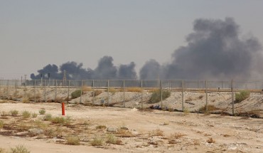 Smoke billows from an Aramco oil facility in Abqaiq about 60km (37 miles) southwest of Dhahran in Saudi Arabia's eastern province on September 14, 2019.