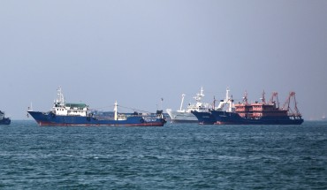 Cargo ships sail in the Gulf off the Iranian port city of Bandar Abbas, which is the main base of the Islamic republic's navy and has a strategic position on the Strait of Hormuz, on April 29, 2019. - Eight countries were initially given six-month reprieves after the United States reimposed sanctions on Iran in November, following President Donald Trump's decision to withdraw from a 2015 nuclear accord. Iran's Foreign Minister Mohammad Javad Zarif has said leaving the nuclear Non-Proliferation Treaty is one