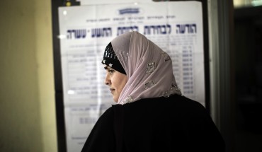 An Arab-Israeli woman waits in line before voting in the northern Israeli village of Maghar January 22, 2013. 