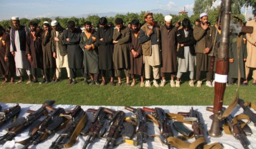 Member of the Islamic state ISIS militants stand alongside their weapons, as they surrendered to government in Jalalabad, Nangarhar, Afghanistan on November 17, 2019. 