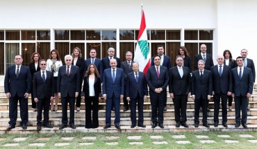 A handout picture provided by the Lebanese photo agency Dalati and Nohra shows Lebanon's Parliament Speaker Nabih Berri (C-L) and President Michel Aoun (C) and prime minister designate Hassan Diab (C-R) posing for a group photo with the newly formed government at the presidential palace in Baabda, east of the capital Beirut, on January 22, 2020.