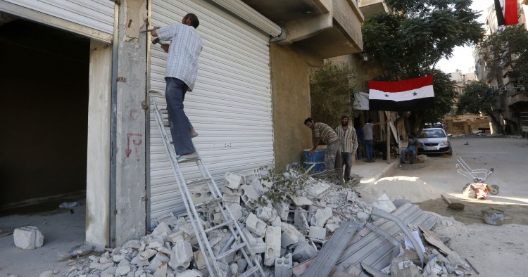 Syrians rebuild their homes in the town of Harasta 