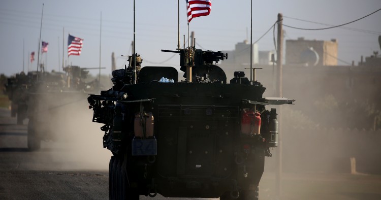 TOPSHOT - A convoy of US forces armoured vehicles drives near the village of Yalanli, on the western outskirts of the northern Syrian city of Manbij, on March 5, 2017. / AFP PHOTO / DELIL SOULEIMAN (Photo credit should read DELIL SOULEIMAN/AFP/Getty Images)