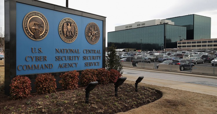 he seals of the U.S. Cyber Command, the National Secrity Agency and the Central Security Service greet employees and visitors at the campus the three organizations share March 13, 2015 in Fort Meade, Maryland.