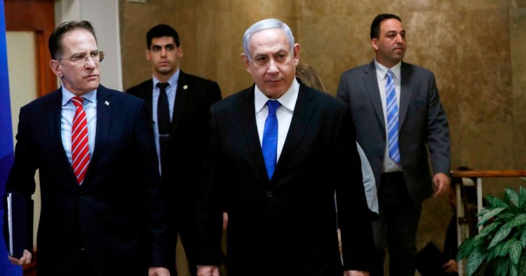Israeli Prime Minister Benjamin Netanyahu (C) arrives at the weekly cabinet meeting in Jerusalem December 8, 2019.