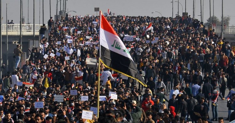 Iraqi students, waving national flags, join anti-government protests in the Shiite shrine city of Najaf in central Iraq on January 28, 2020.